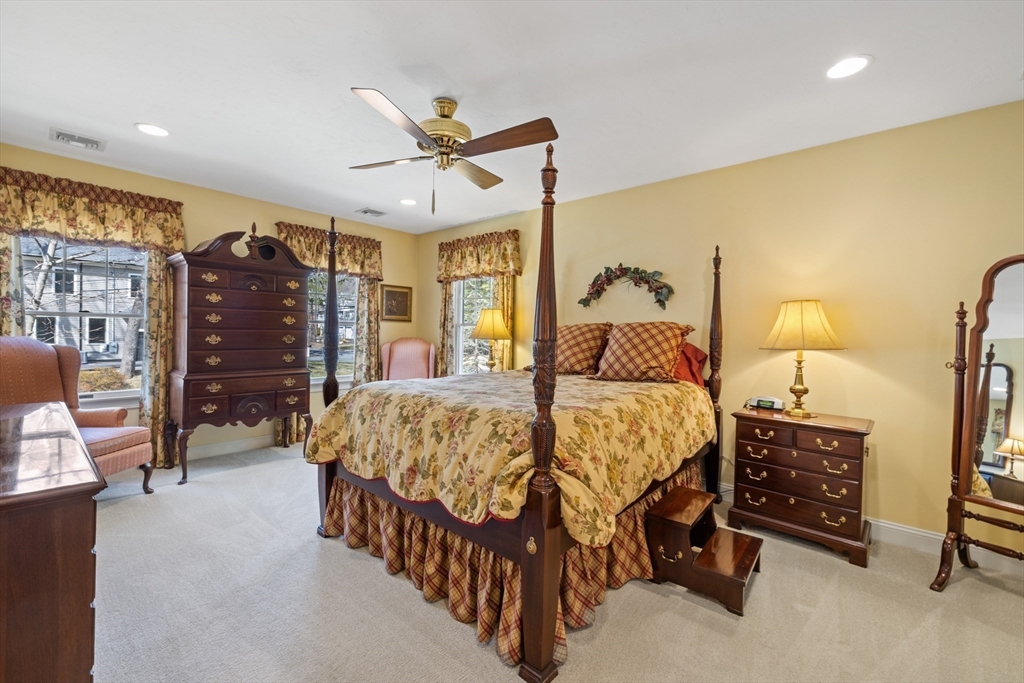 2 Marlboro Road Lexington, MA 02421 - Photo 21 of 36 a bedroom with a bed a couch and a walk in closet