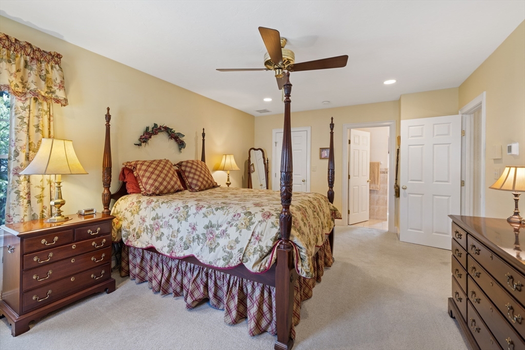 2 Marlboro Road Lexington, MA 02421 - Photo 22 of 36 a bedroom with a bed and a chandelier