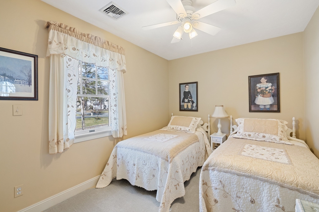 2 Marlboro Road Lexington, MA 02421 - Photo 26 of 36 a bedroom with a bed and a painting on the wall