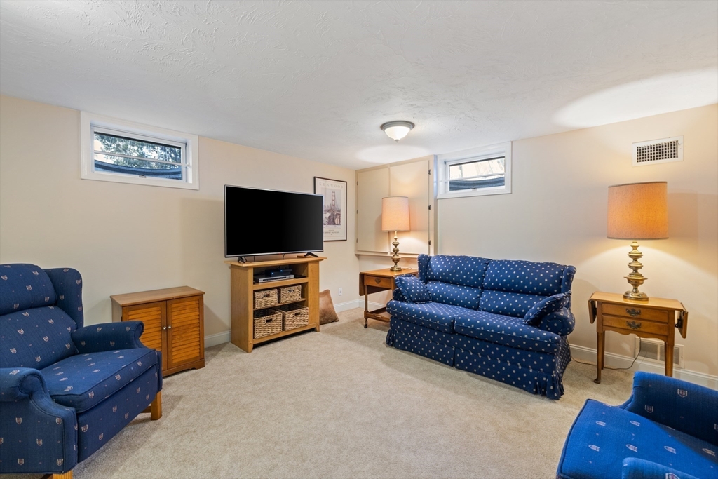 2 Marlboro Road Lexington, MA 02421 - Photo 27 of 36 a living room with furniture and a flat screen tv