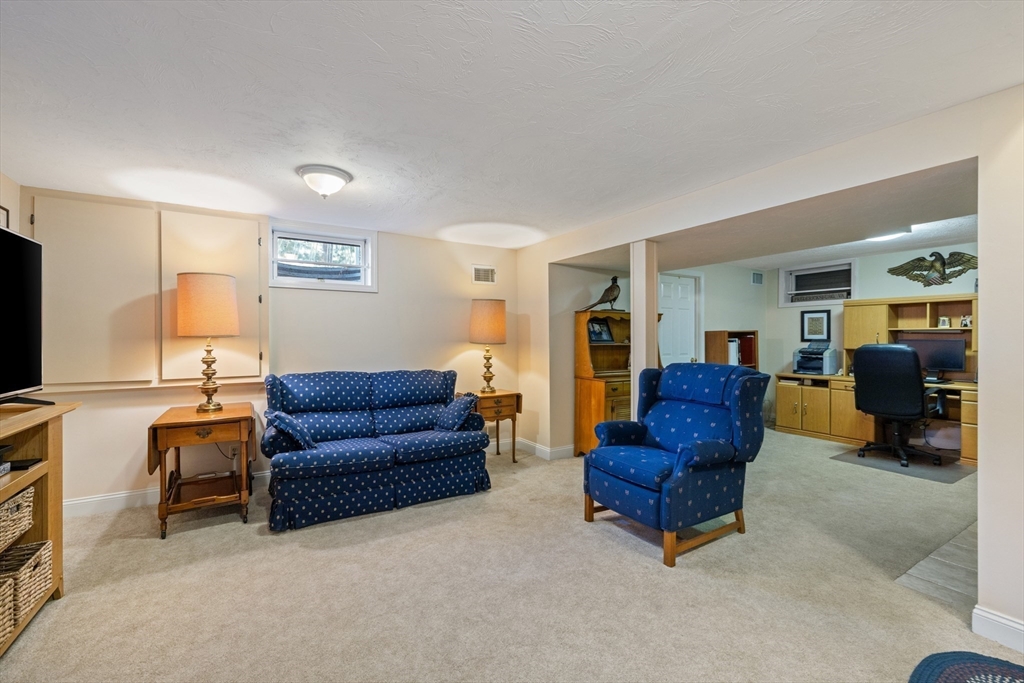 2 Marlboro Road Lexington, MA 02421 - Photo 28 of 36 a living room with furniture and a flat screen tv