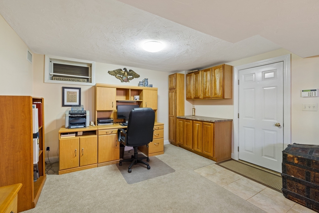 2 Marlboro Road Lexington, MA 02421 - Photo 29 of 36 a view of a workspace with furniture and windows