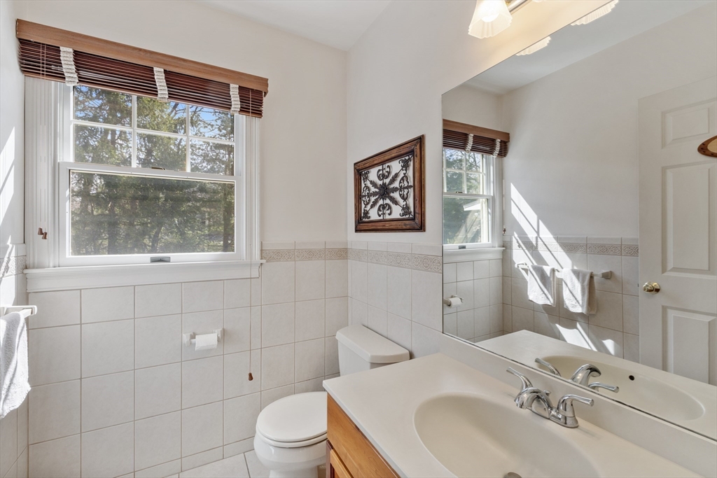 2 Marlboro Road Lexington, MA 02421 - Photo 30 of 36 a bathroom with a sink and a mirror
