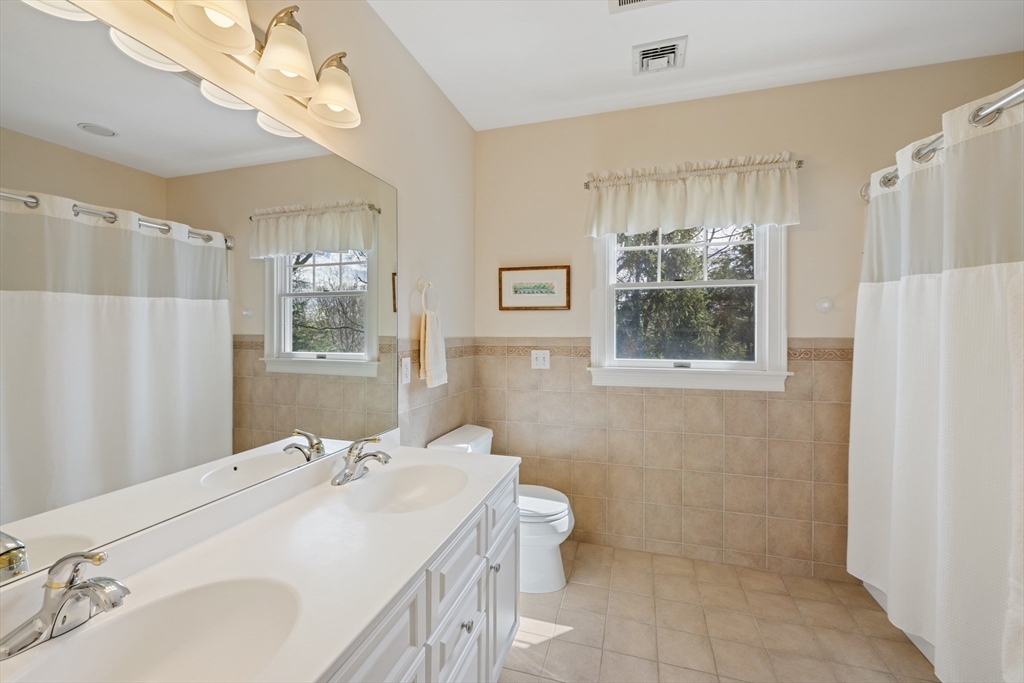 2 Marlboro Road Lexington, MA 02421 - Photo 31 of 36 a bathroom with a sink toilet and shower