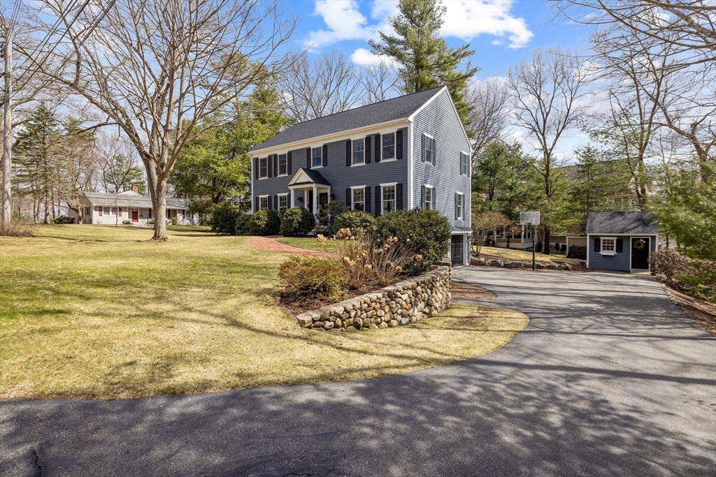 2 Marlboro Road Lexington, MA 02421 - Photo 33 of 36 a view of a house with snow on the side of the road