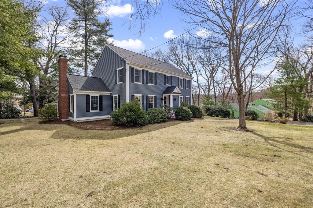 2 Marlboro Road Lexington, MA 02421 - Photo 34 of 36 a front view of a house with a yard and trees