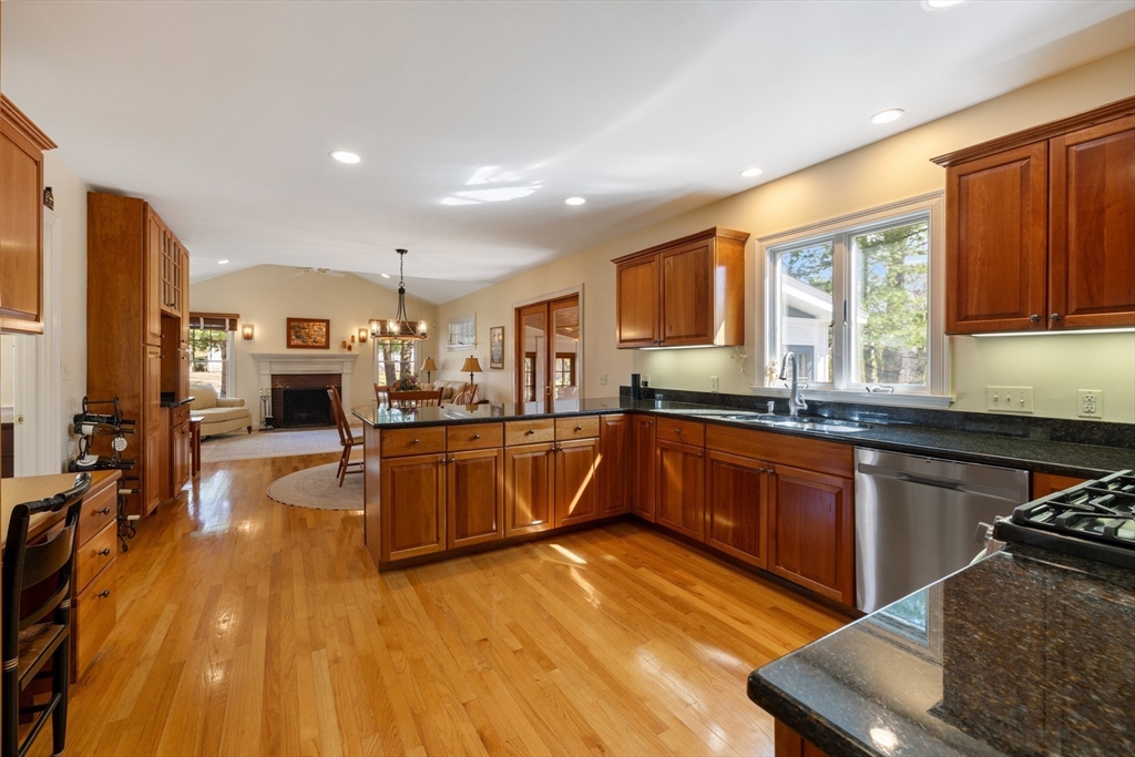 2 Marlboro Road Lexington, MA 02421 - Photo 5 of 36 a kitchen with stainless steel appliances granite countertop a sink stove and wooden cabinets