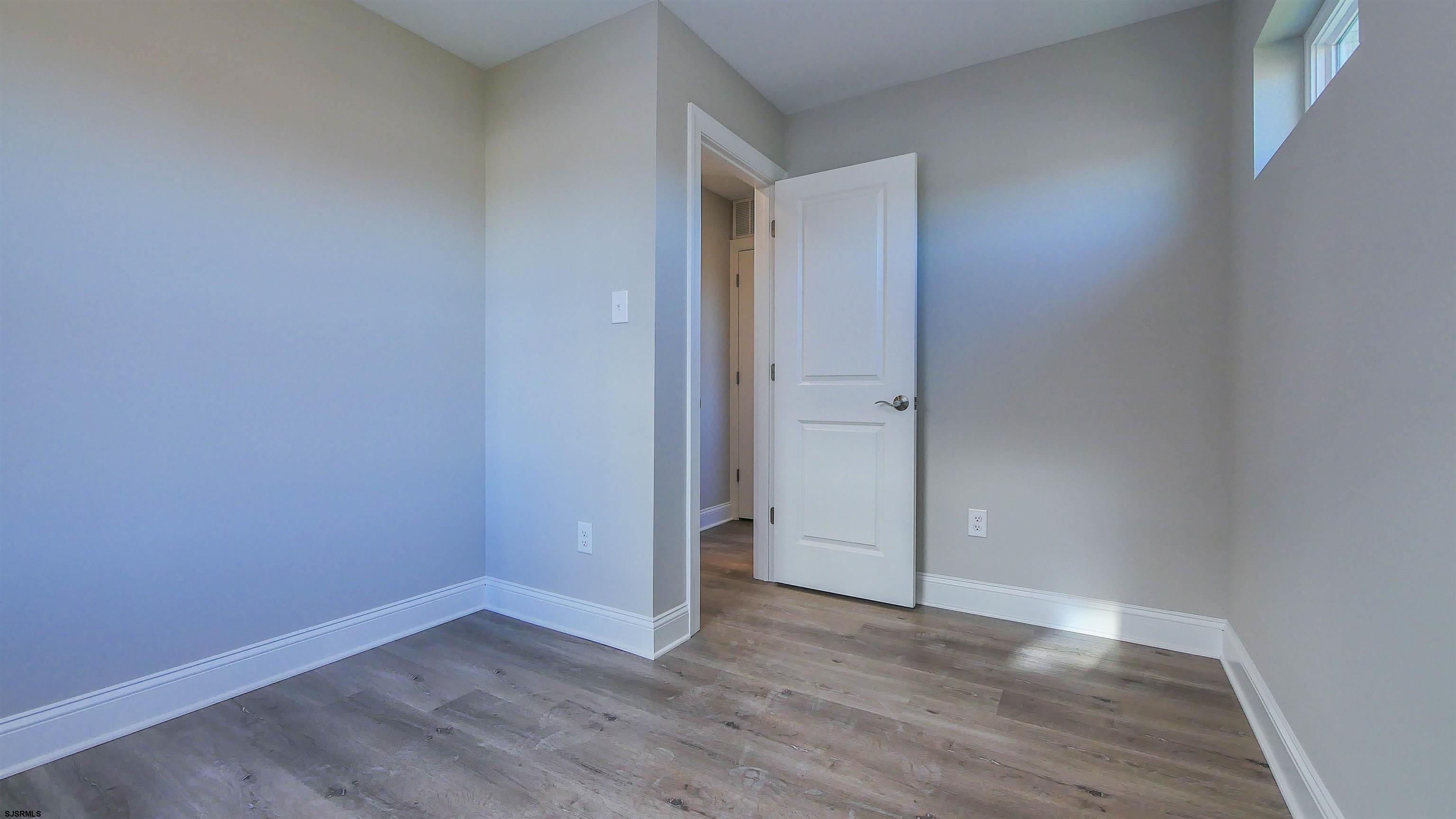 539 Sunset Avenue Somers Point, NJ 08244 - Photo 14 of 34 a view of an empty room and wooden floor