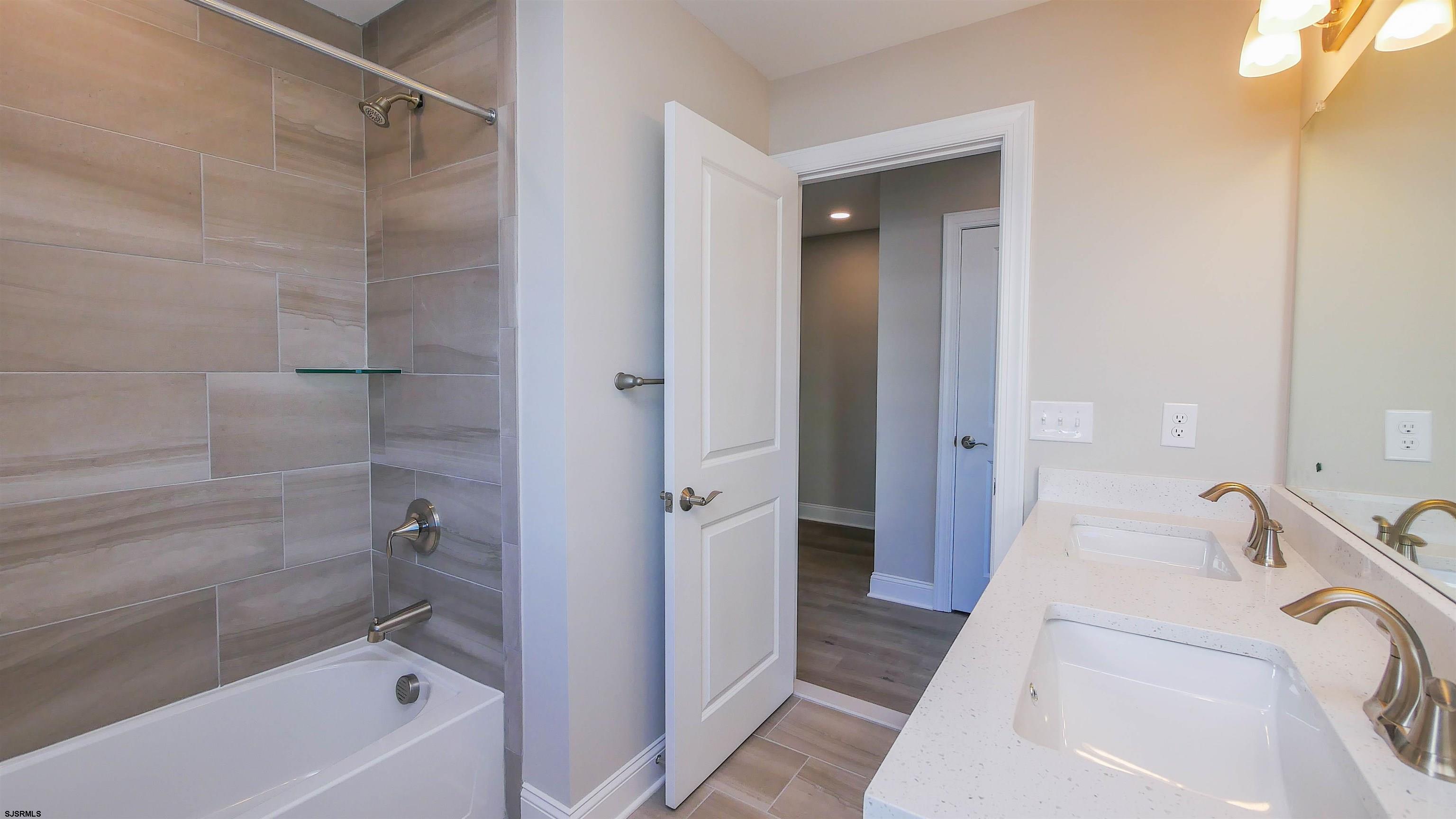 539 Sunset Avenue Somers Point, NJ 08244 - Photo 20 of 34 a bathroom with a sink a toilet and shower