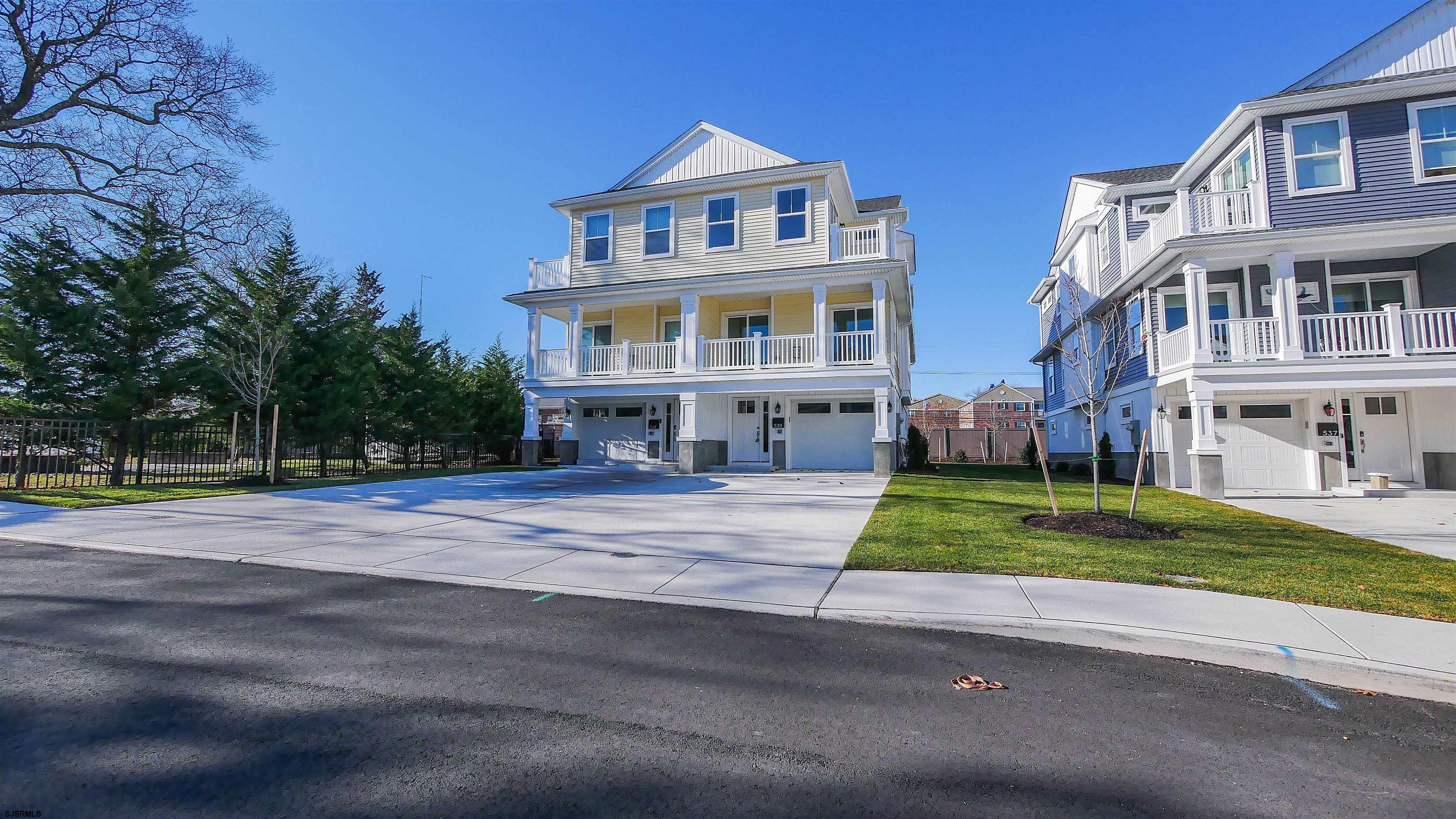 539 Sunset Avenue Somers Point, NJ 08244 - Photo 2 of 34 a front view of residential houses with yard and green space