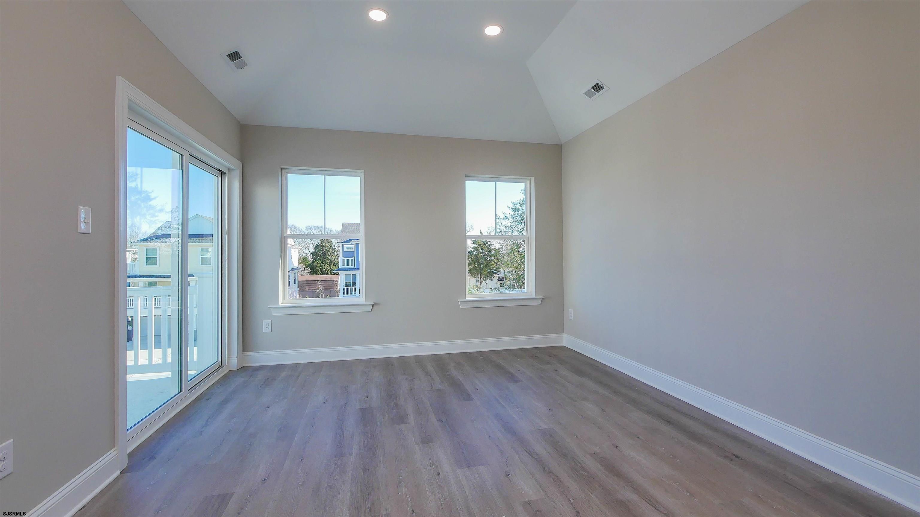 539 Sunset Avenue Somers Point, NJ 08244 - Photo 23 of 34 an empty room with wooden floor and windows