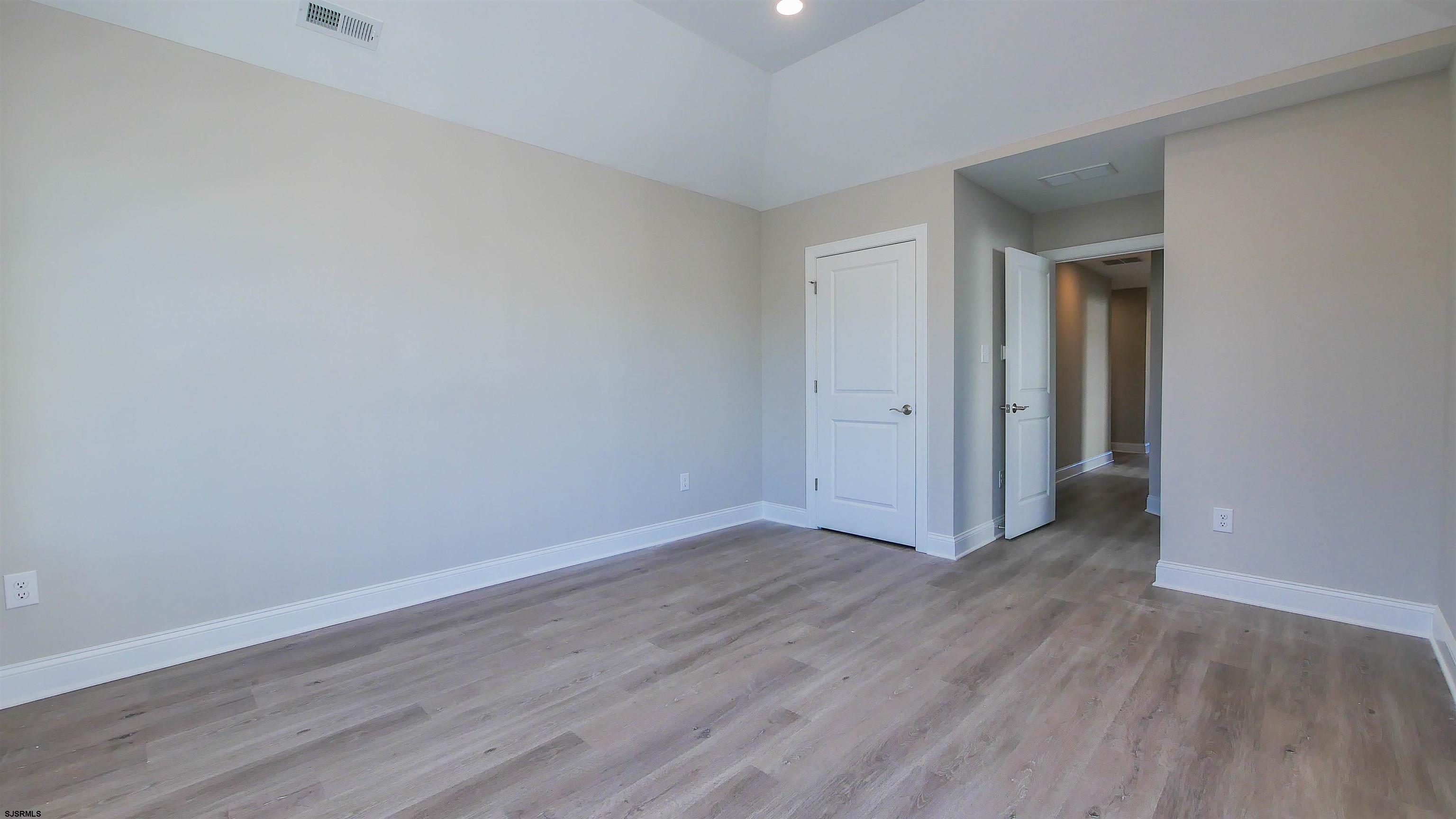 539 Sunset Avenue Somers Point, NJ 08244 - Photo 25 of 34 a view of an empty room with wooden floor