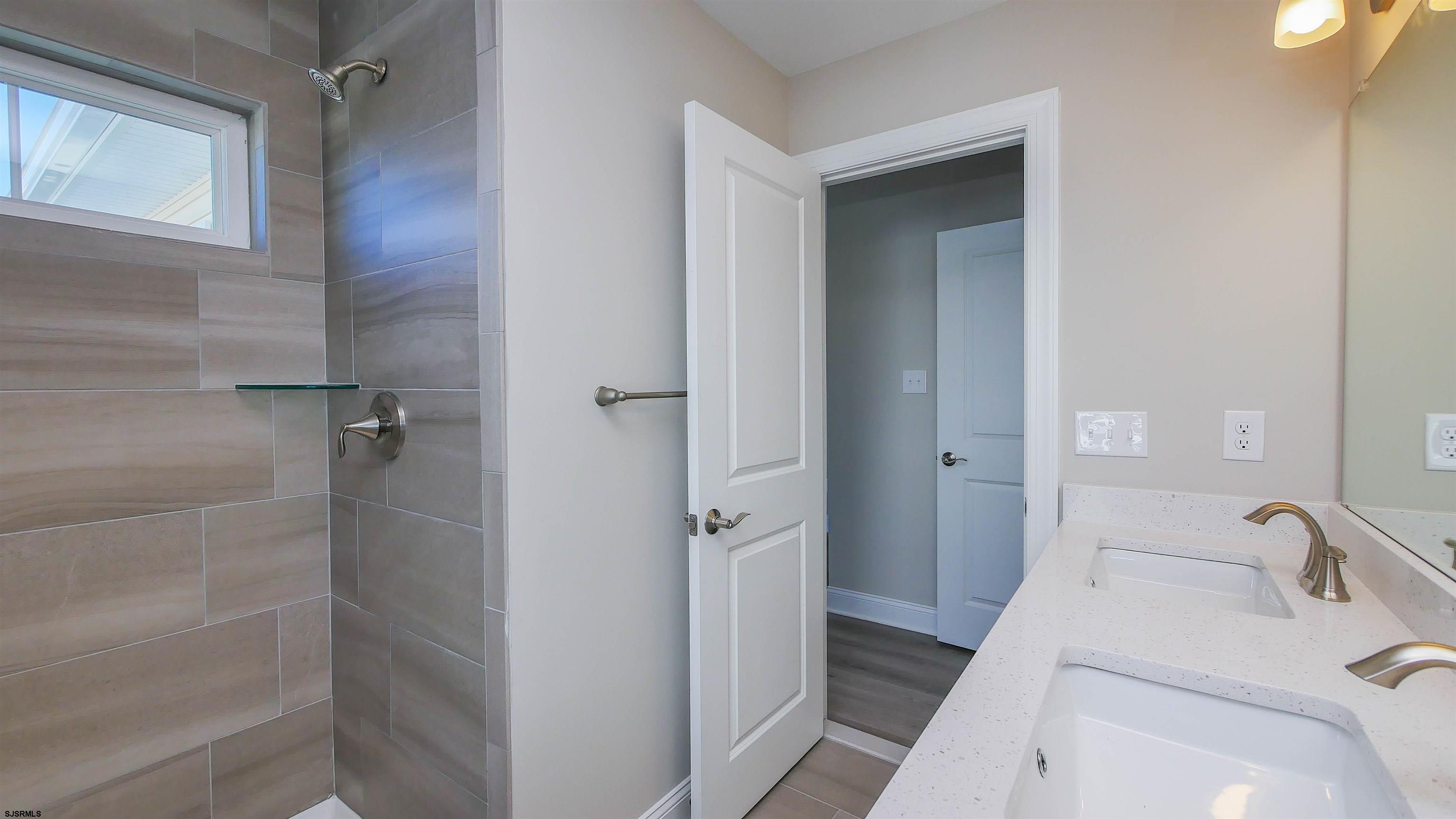 539 Sunset Avenue Somers Point, NJ 08244 - Photo 27 of 34 a bathroom with a sink and a shower