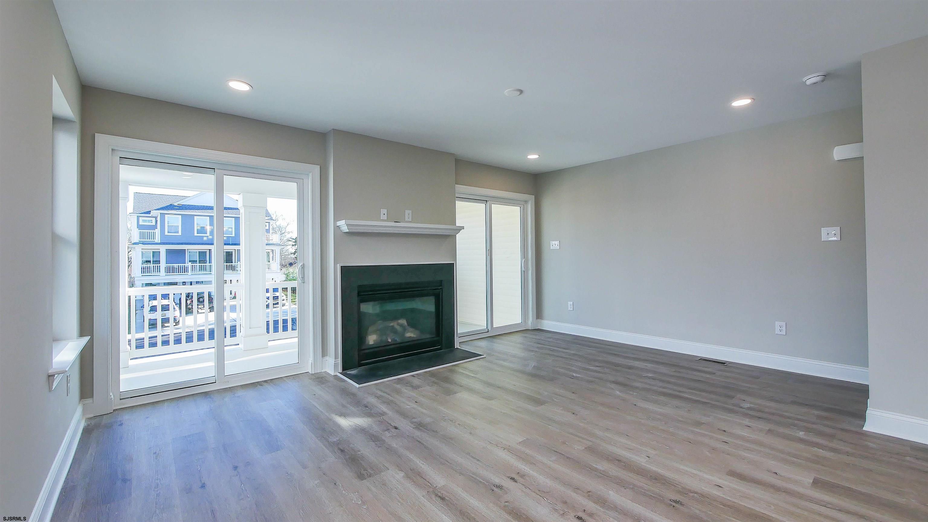 539 Sunset Avenue Somers Point, NJ 08244 - Photo 9 of 34 a view of an empty room with wooden floor and a window