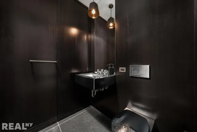 a bathroom with a sink and mirror