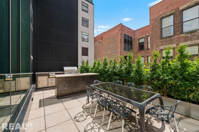a view of a dinning table and chairs in the patio