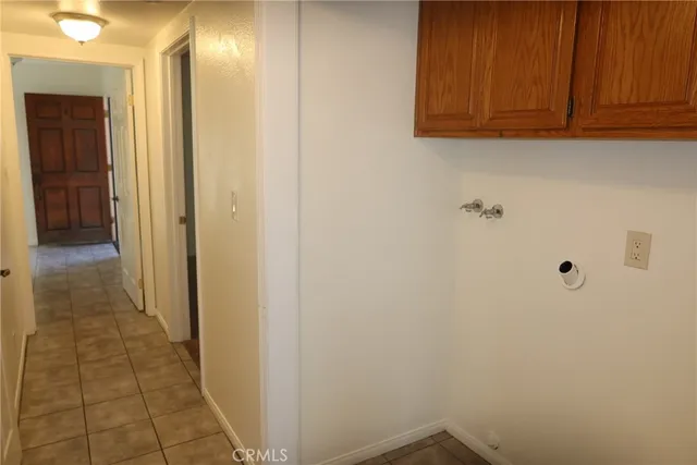 a kitchen with stainless steel appliances granite countertop a sink stove refrigerator and cabinets