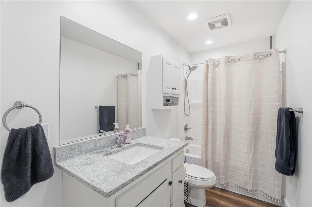 728 East Northern Avenue Springfield, OH 45503 - Photo 25 of 35 This bathroom features a sleek vanity, a convenient shower-tub combination, and bright, inviting lighting.