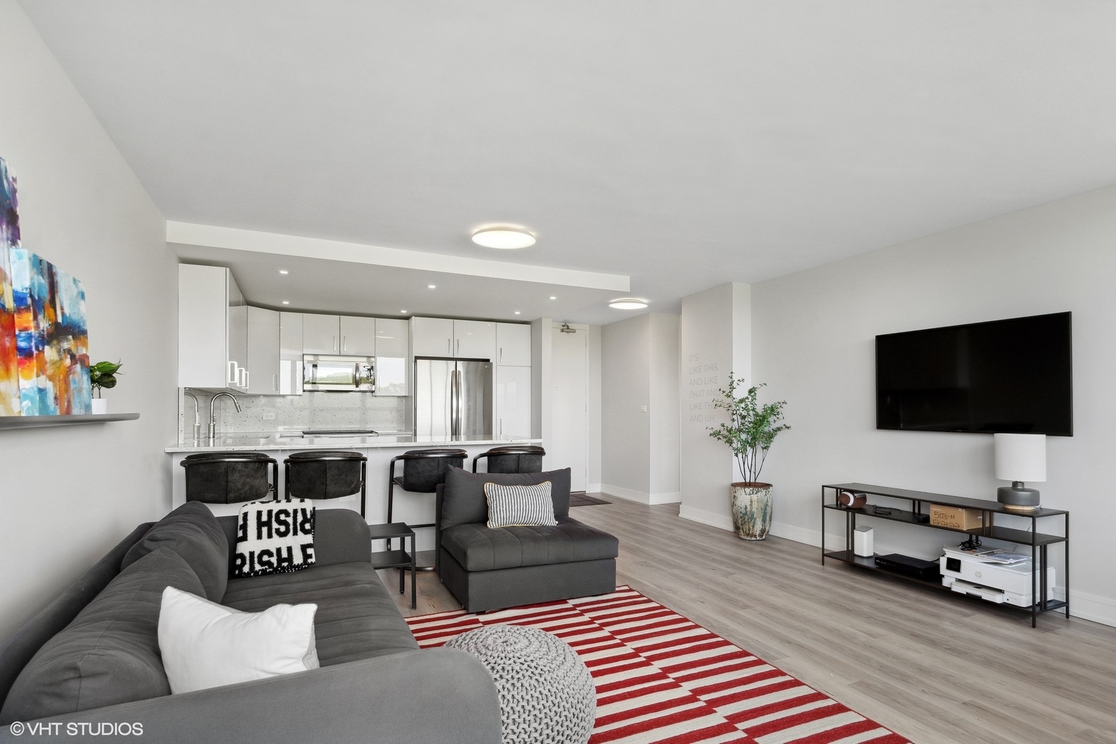 4800 South Chicago Beach Drive, Unit 503N Chicago, IL 60615 - Photo 11 of 15 a living room with furniture and a flat screen tv