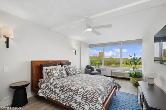 a bed room with a bed and a window