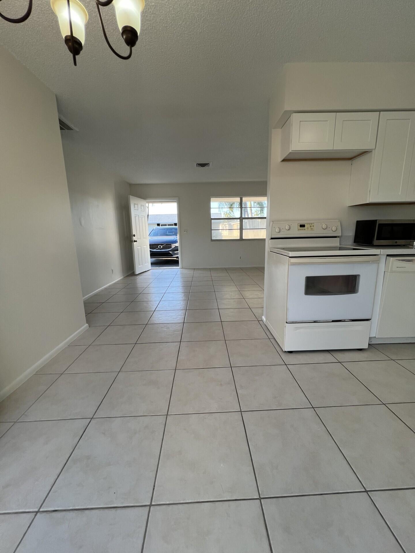 2845 Duke Lane Delray Beach, FL 33445 - Photo 14 of 15 a view of a kitchen with a sink and cabinets