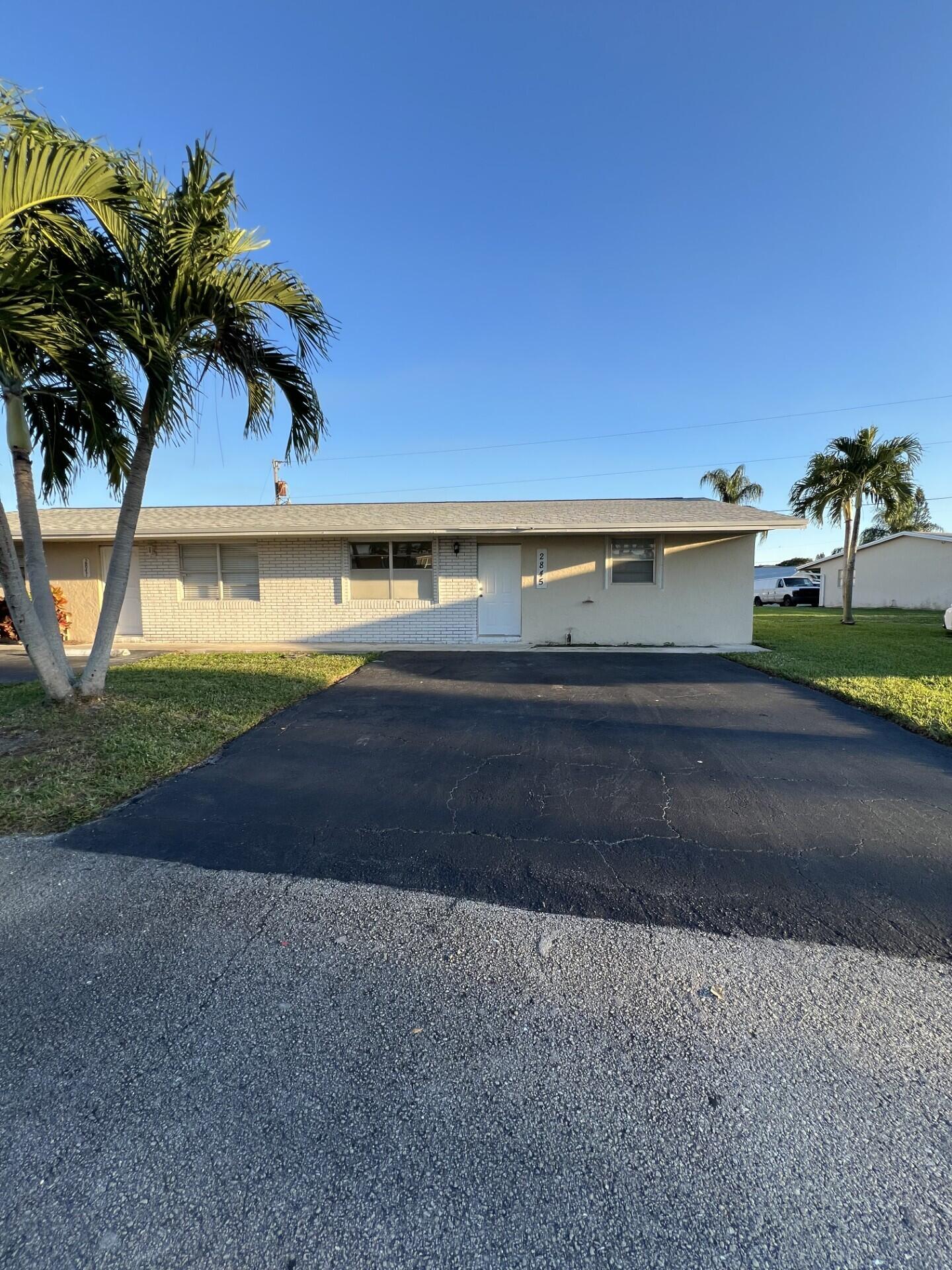 2845 Duke Lane Delray Beach, FL 33445 - Photo 2 of 15 a view of a yard