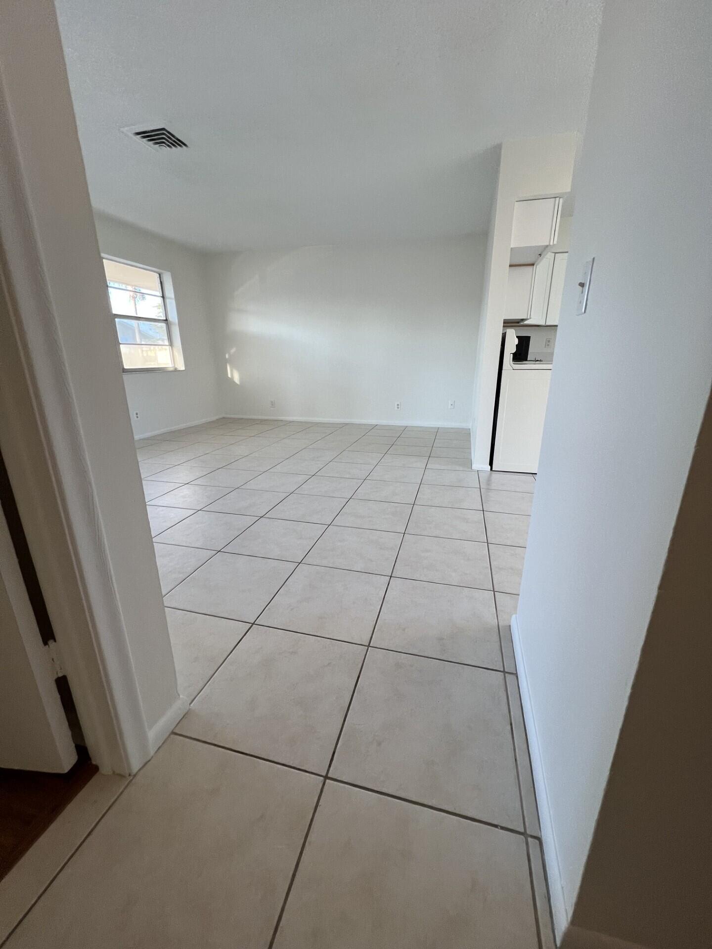 2845 Duke Lane Delray Beach, FL 33445 - Photo 7 of 15 a view of an empty room with windows