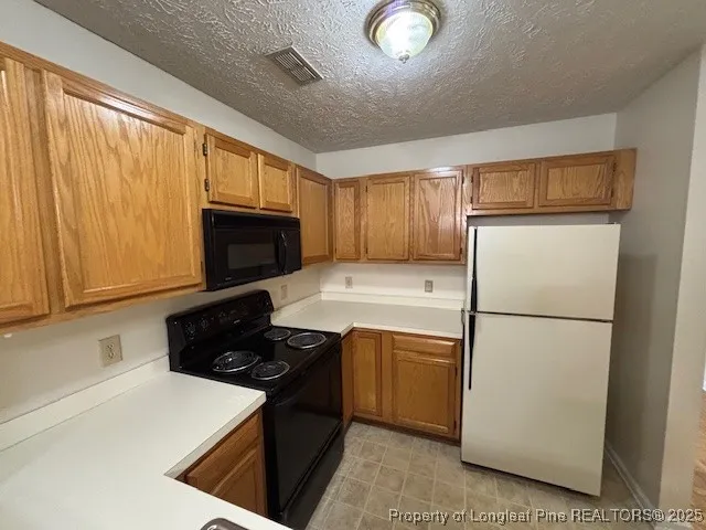 a view of empty room with fireplace