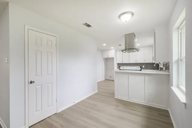 a view of kitchen with wooden floor