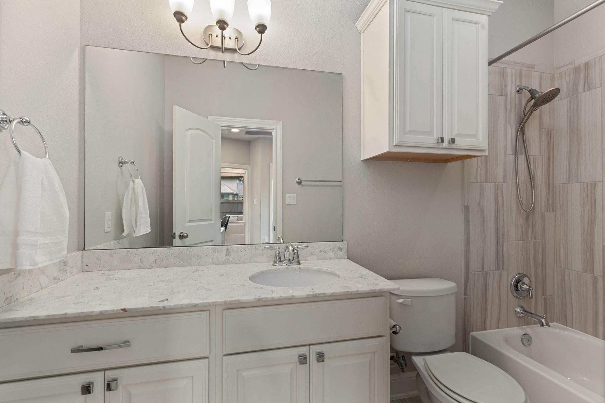 3028 Silvergrass Cove Leander, TX 78641 - Photo 14 of 38 Full bath with tub / shower combination and vanity