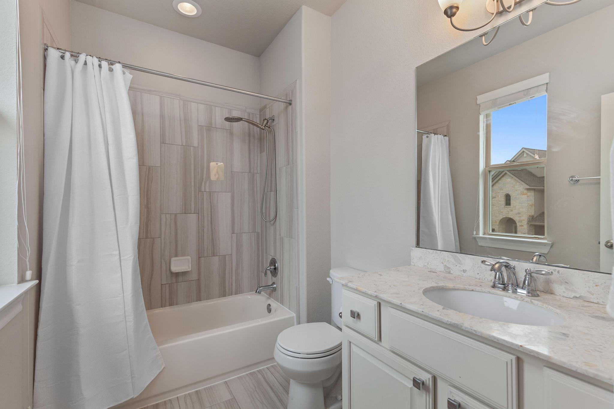 3028 Silvergrass Cove Leander, TX 78641 - Photo 27 of 38 Full bathroom with vanity and shower / bath combo