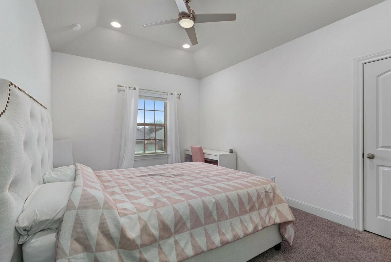 3028 Silvergrass Cove Leander, TX 78641 - Photo 29 of 38 Carpeted bedroom with recessed lighting, ceiling fan, and lofted ceiling