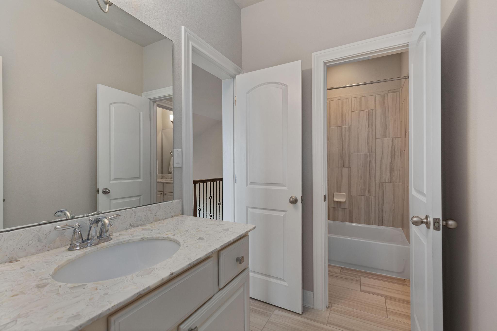 3028 Silvergrass Cove Leander, TX 78641 - Photo 31 of 38 Bathroom with vanity and shower / bath combination
