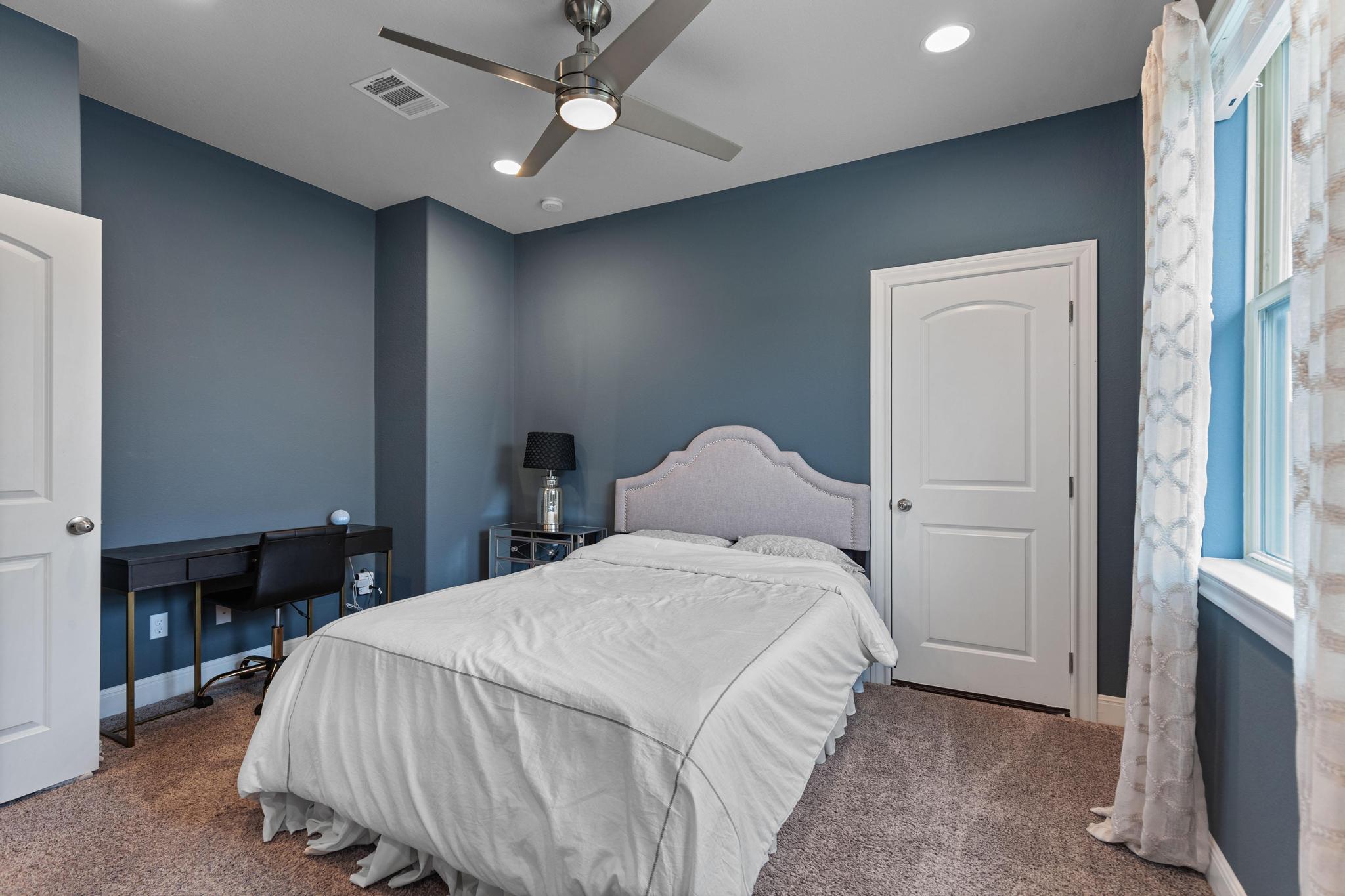 3028 Silvergrass Cove Leander, TX 78641 - Photo 32 of 38 Carpeted bedroom featuring a ceiling fan, an office area, and recessed lighting