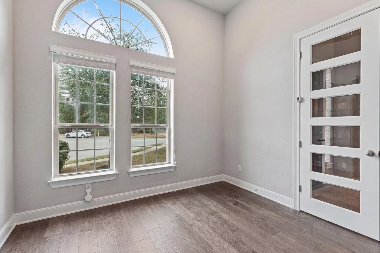 3028 Silvergrass Cove Leander, TX 78641 - Photo 7 of 38 Empty room featuring baseboards and light wood finished floors