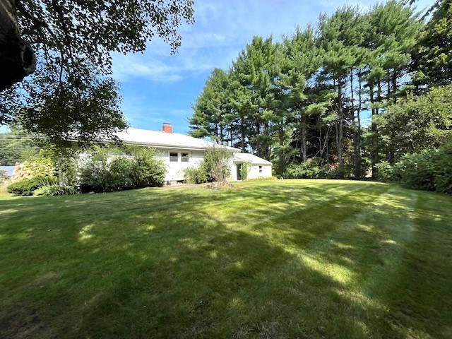 21 Chamberlain Road Chelmsford, MA 01824 - Photo 2 of 13 a front view of a house with garden