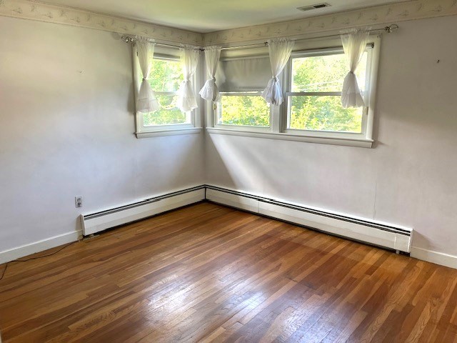 21 Chamberlain Road Chelmsford, MA 01824 - Photo 10 of 13 a view of a room with wooden floor and a window