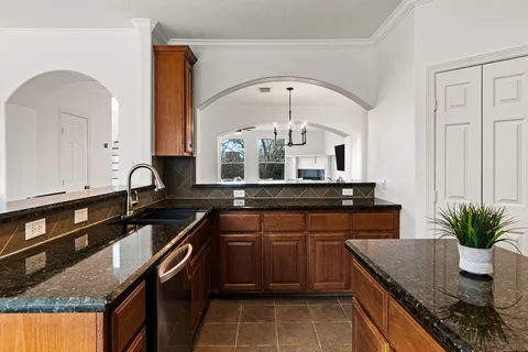a kitchen with a sink and cabinets