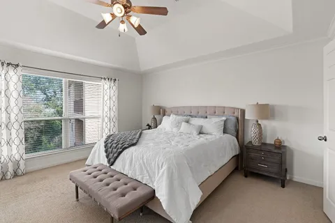 a bedroom with bed and a window