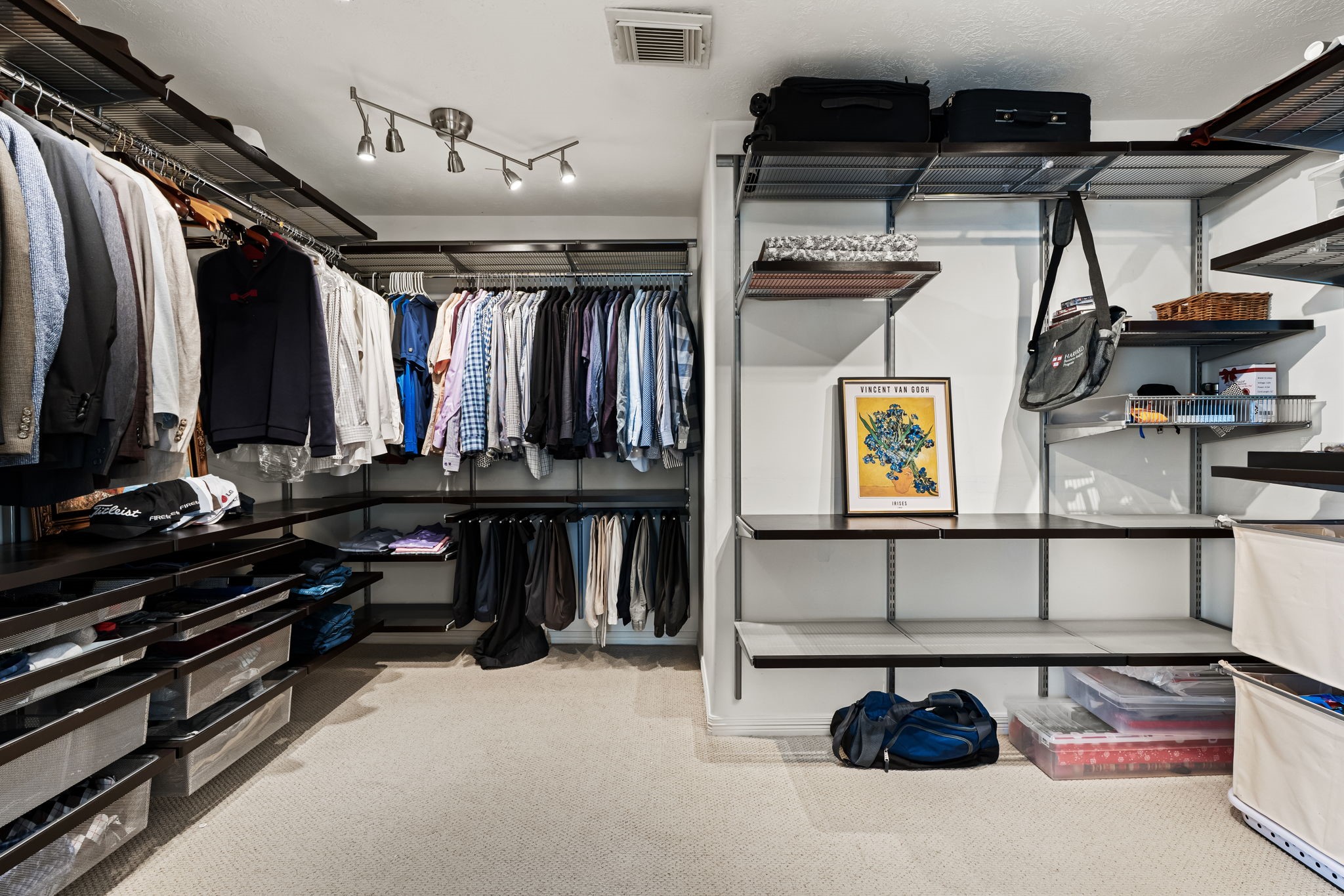 1846 Stacy Crest Houston, TX 77008 - Photo 20 of 32 Through the bathroom lies an impressively sized walk-in closet with custom built shelving, designed to keep everything organized with ease. The open layout makes the space feel more like a dedicated dressing room.