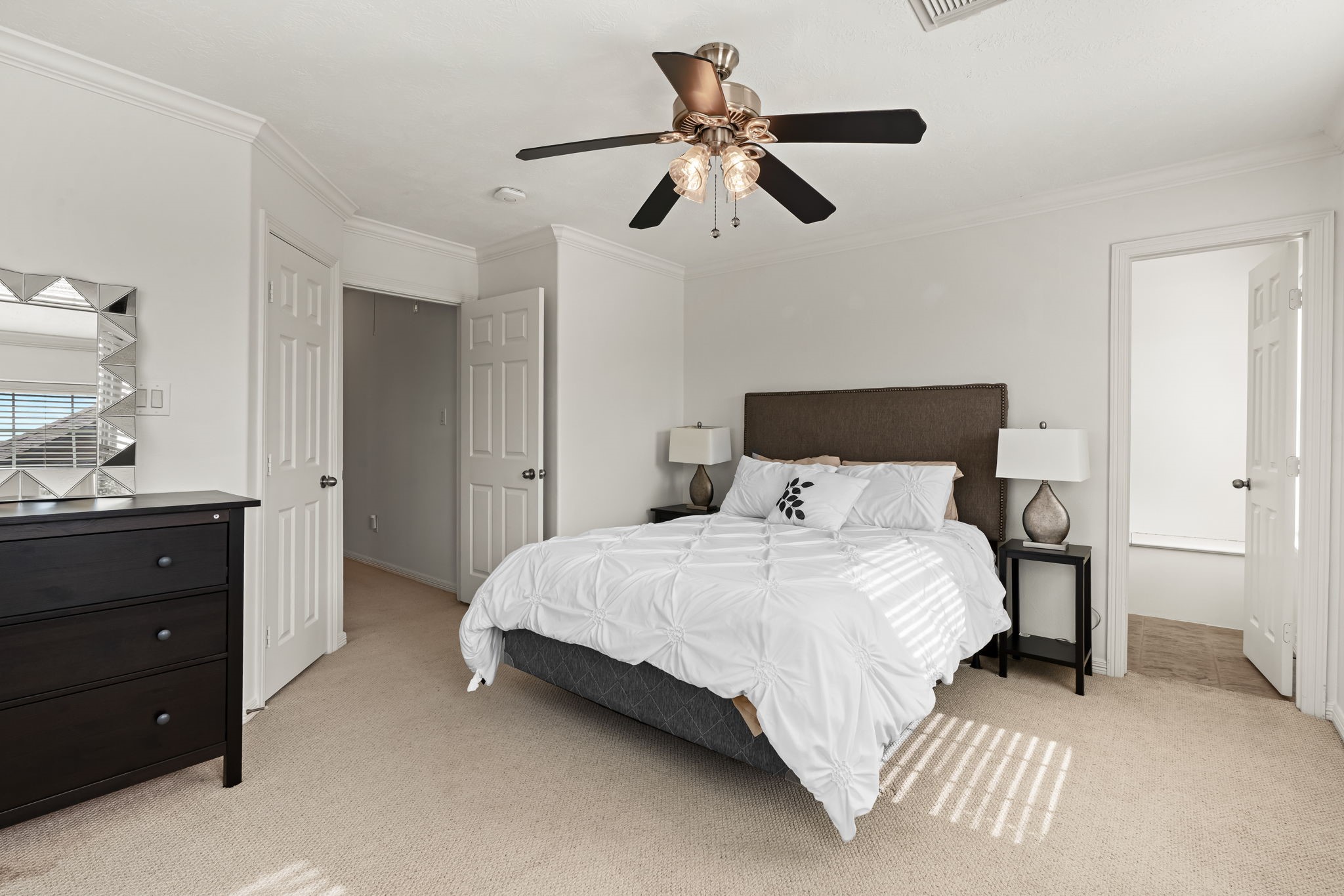 1846 Stacy Crest Houston, TX 77008 - Photo 22 of 32 a bedroom with a bed and a chandelier