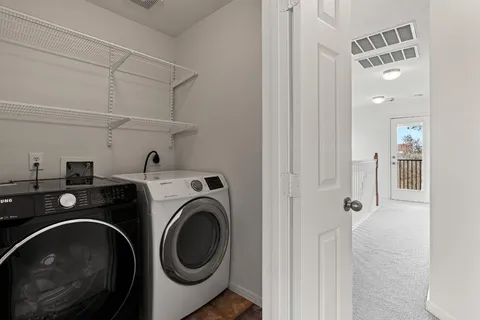 a utility room with dryer and washer