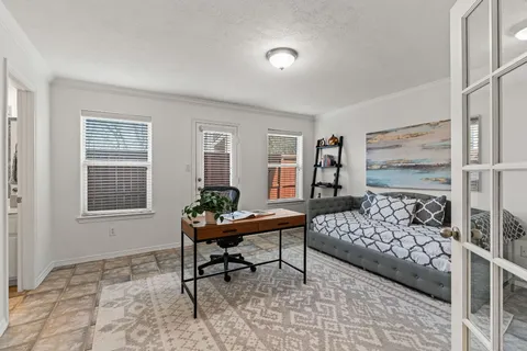 a living room with furniture and windows