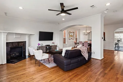 a living room with furniture fireplace and a flat screen tv
