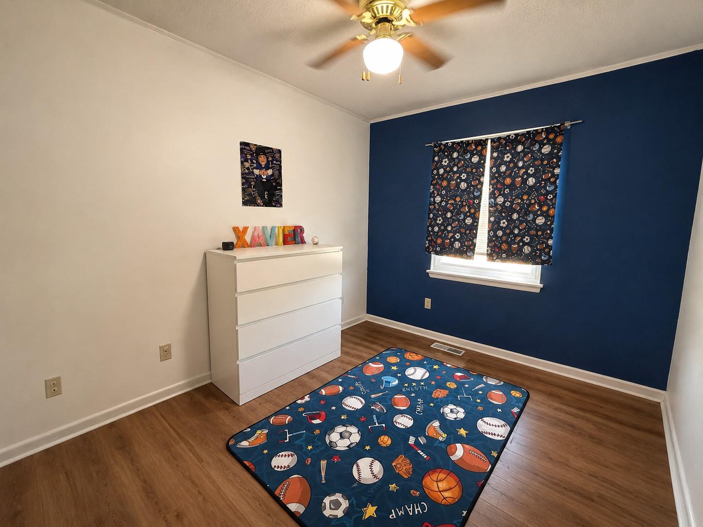 813 Thimbleberry Road, Unit 813 Baltimore, MD 21220 - Photo 21 of 32 Bedroom 3: Cosmic-themed kids' room view.