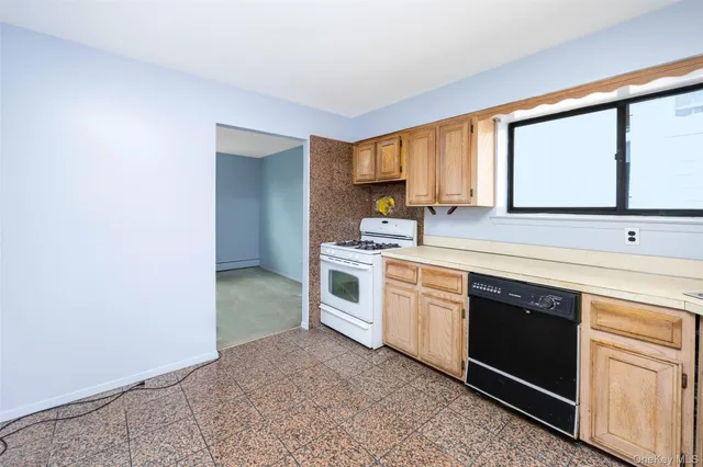 a kitchen with a stove oven and sink