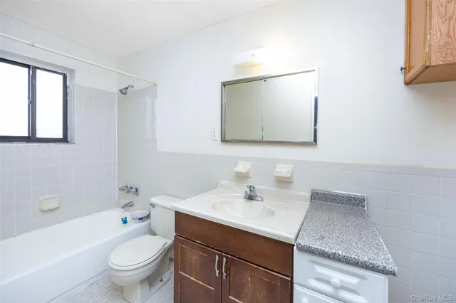 a bathroom with a sink a toilet and a bathtub