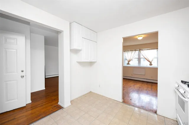 a view of hallway with wooden floor
