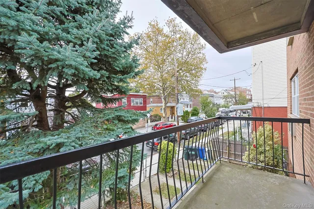 a view of a balcony with trees