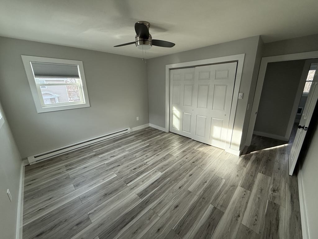 12 Hunnewell Road, Unit 2R Worcester, MA 01606 - Photo 3 of 13 a view of empty room with wooden floor